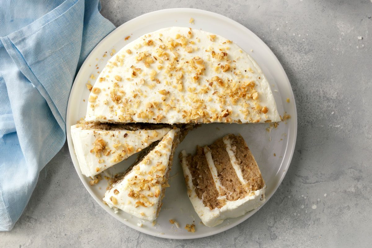 Hummingbird Cake from above on a plate and cut into slices