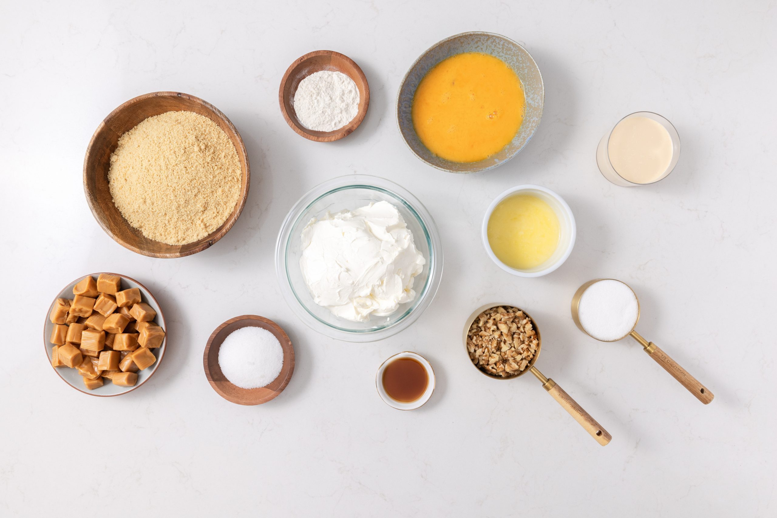 Ingredients For Caramel Cheesecake On Kitchen Counter.