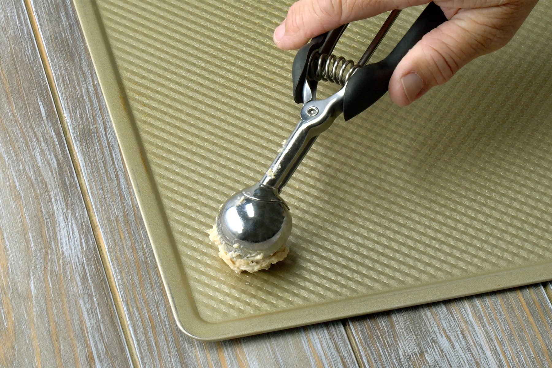 Drop dough by tablespoonfuls onto greased baking sheets.