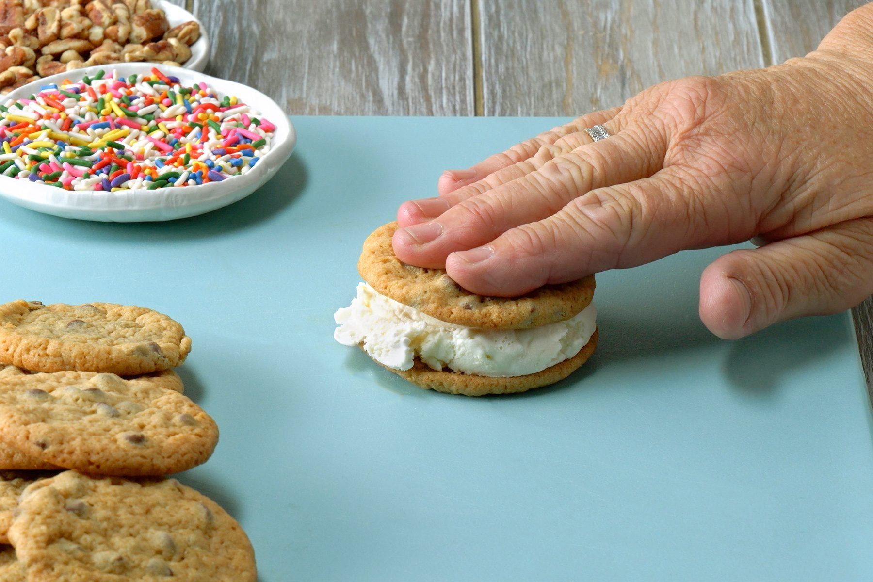 Top half of cookies with a scoop of ice cream