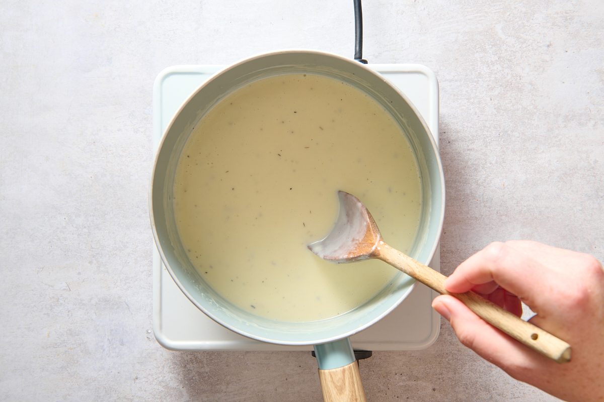 Thickening a roux in a saucepan