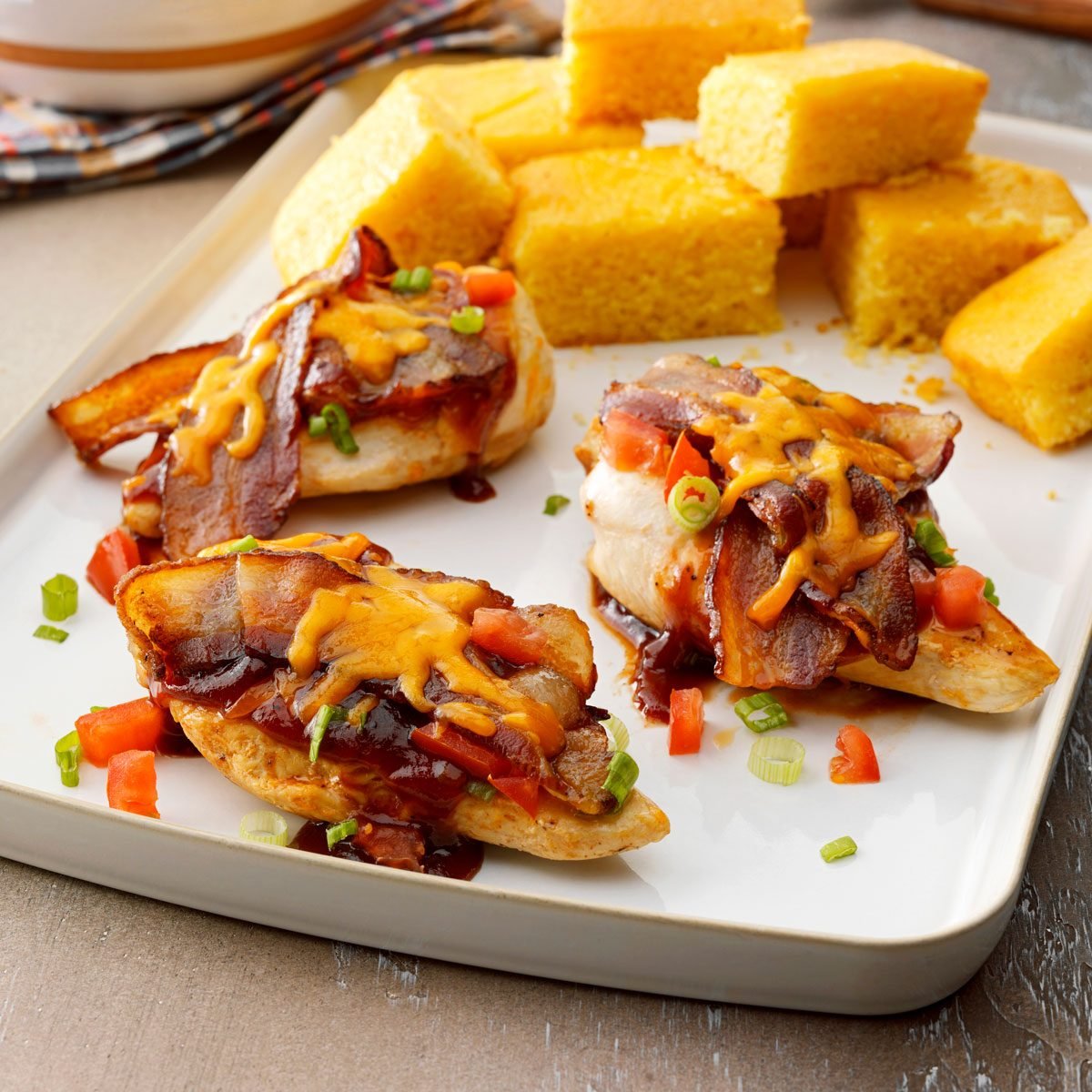 Monterey Chicken on a tray served with corn bread