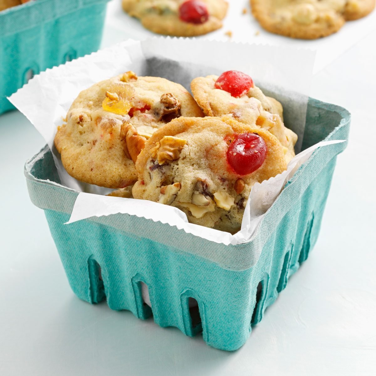 Fruitcake Cookies served in a teal produce quart container
