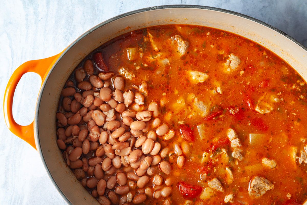 Step 3 of Taste of Home Green Chile Pork Stew is to add the beans and return to a simmer