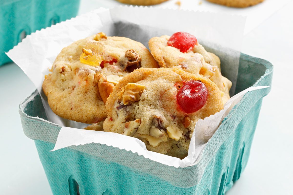 Fruitcake Cookies served in a teal produce quart container