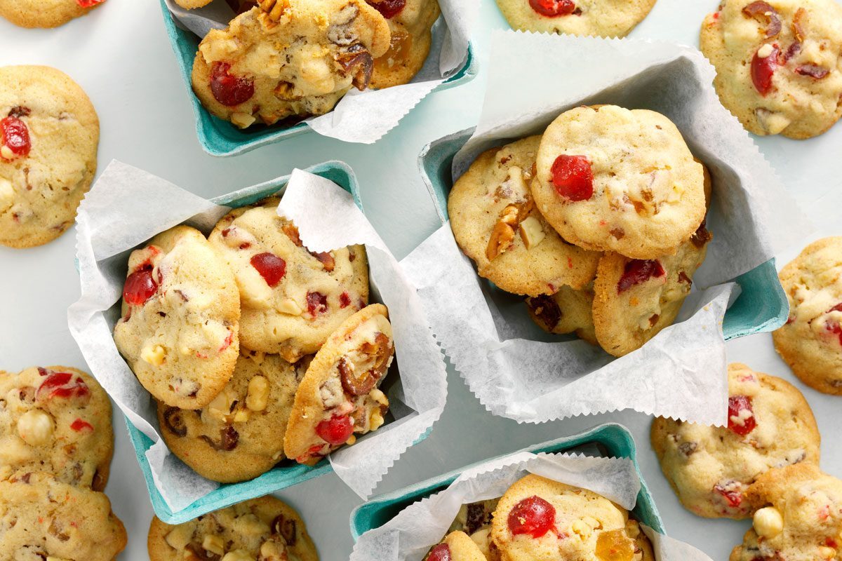 Top view of Fruitcake Cookies served in a teal produce quart container