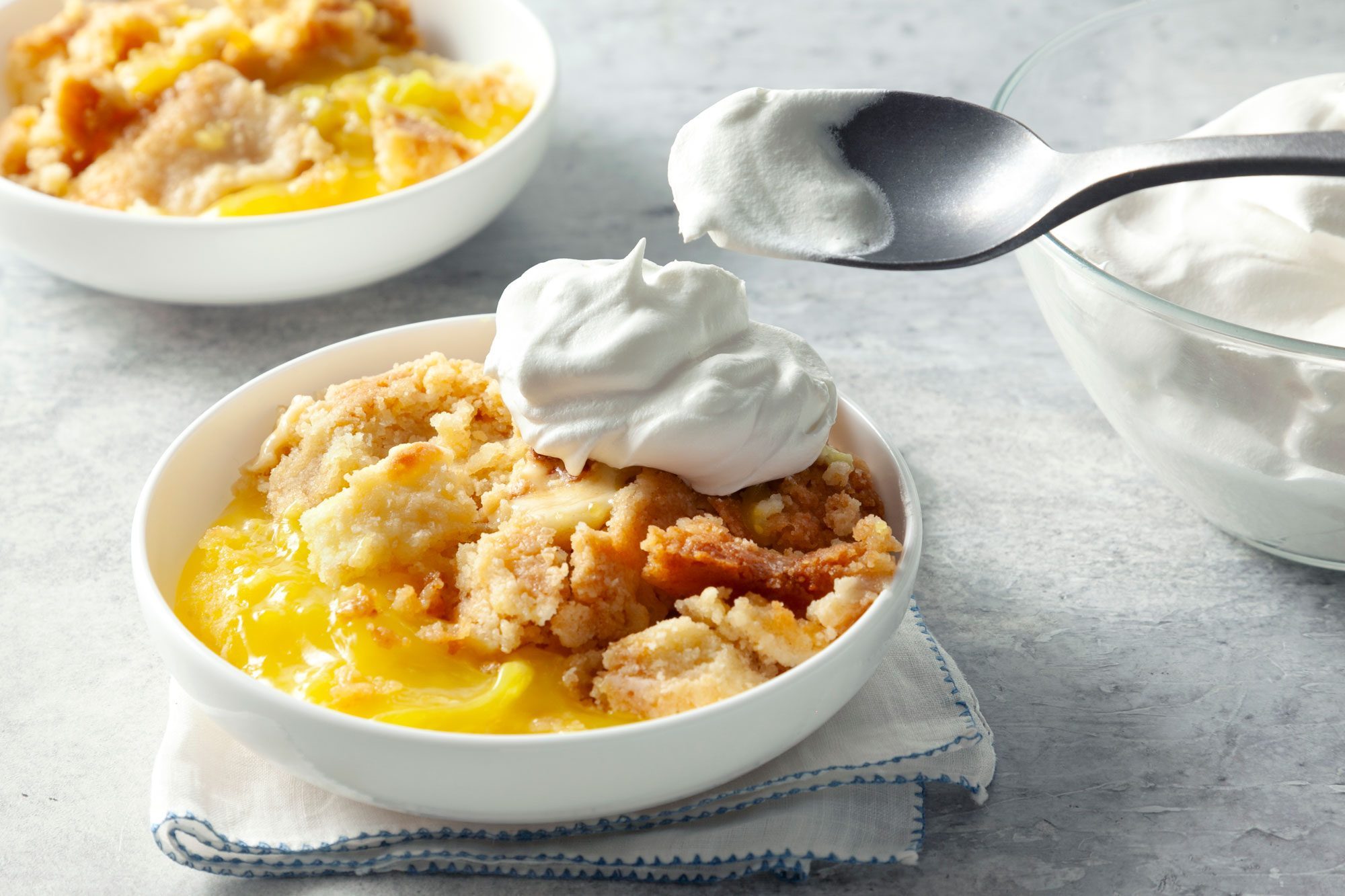 Lemon Dump Cake served warm with whipped cream