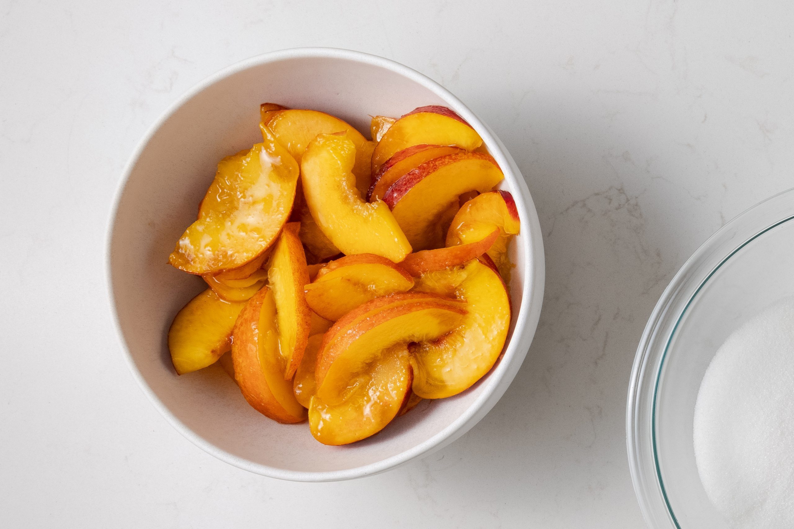 Bowl of sugar coated nectarines.