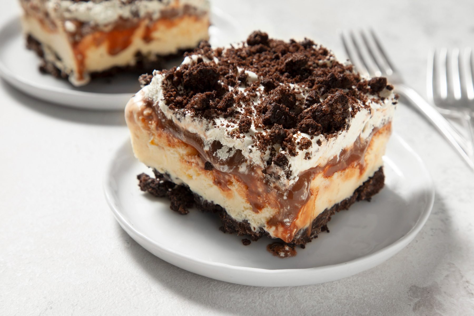 A piece of Oreo Ice Cream Cake served in a dessert plate 