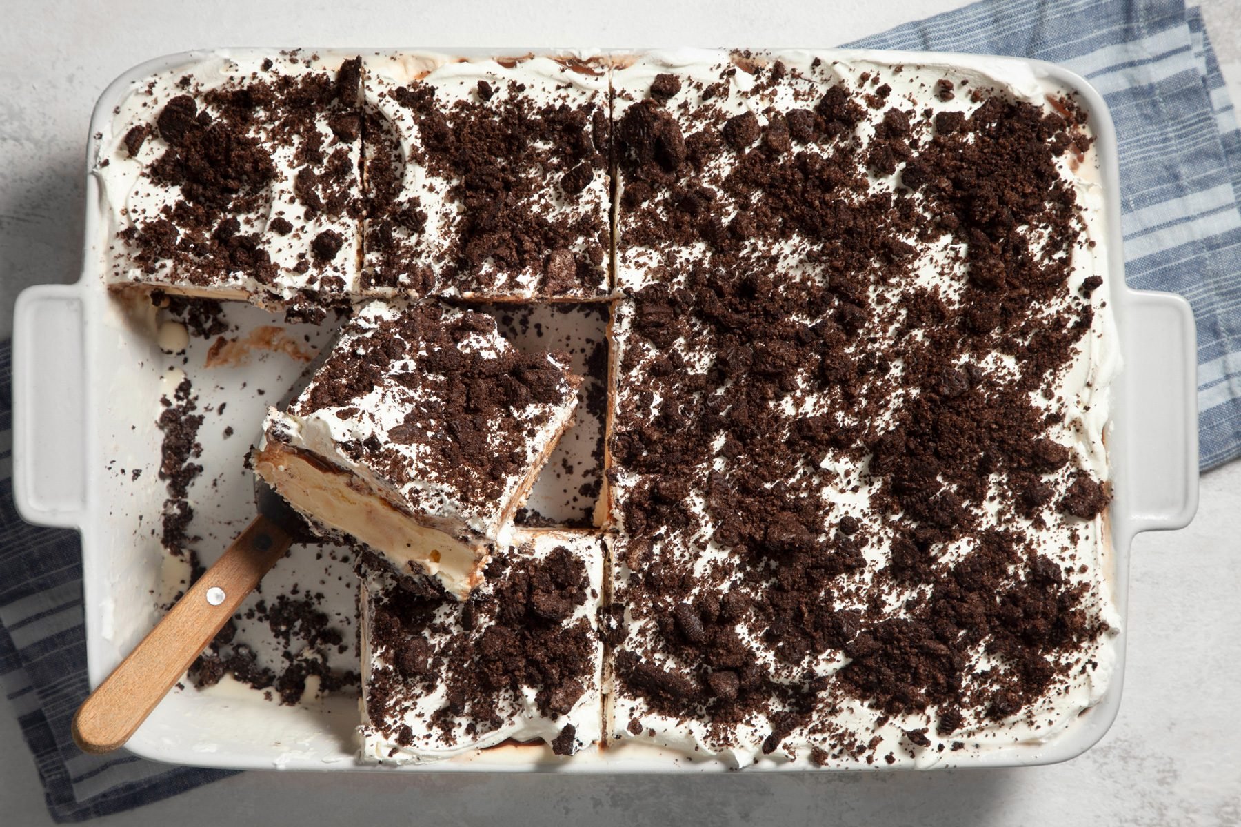 Top shot of slicing Oreo Ice Cream Cake