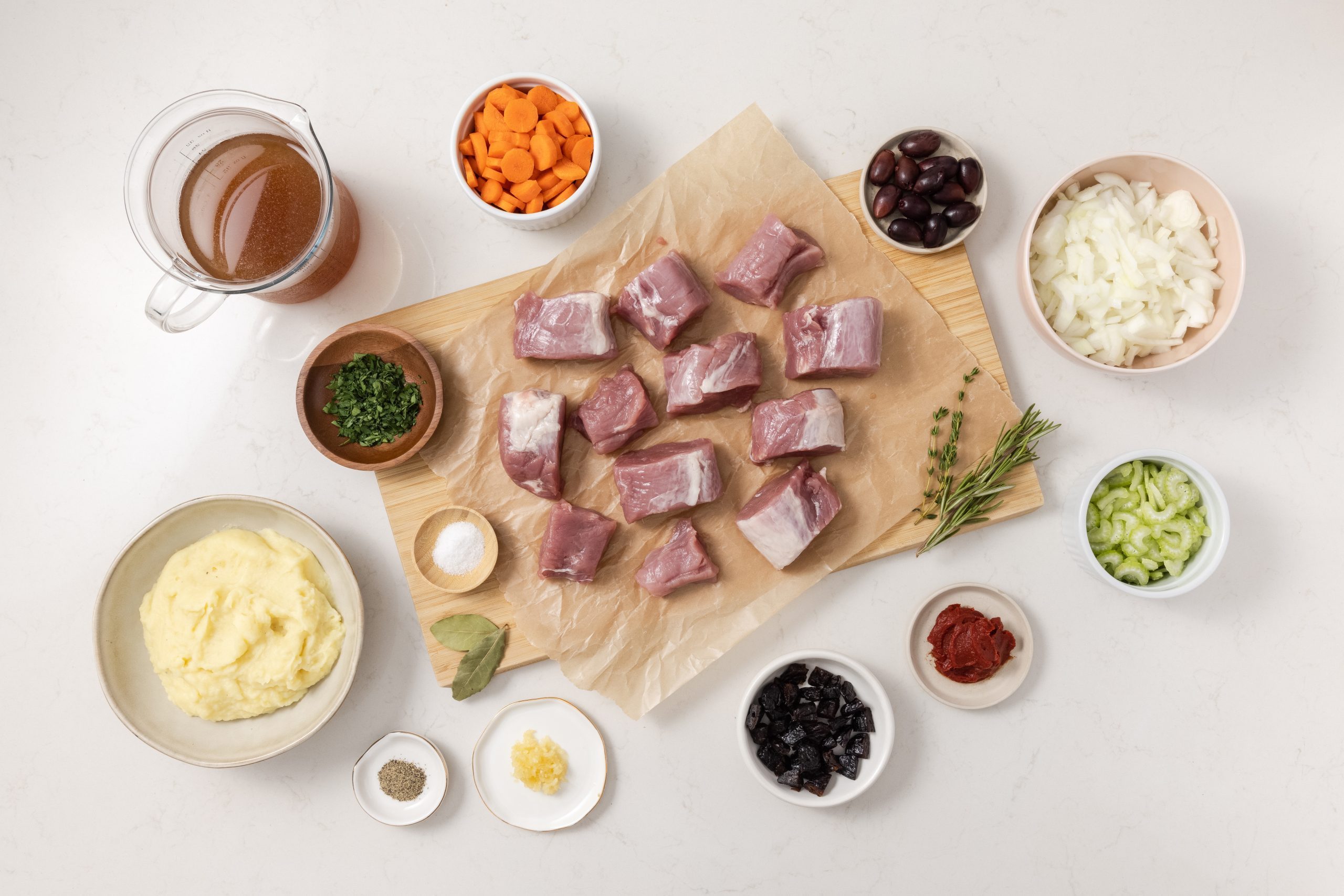 Ingredients for pork stew on kitchen counter.