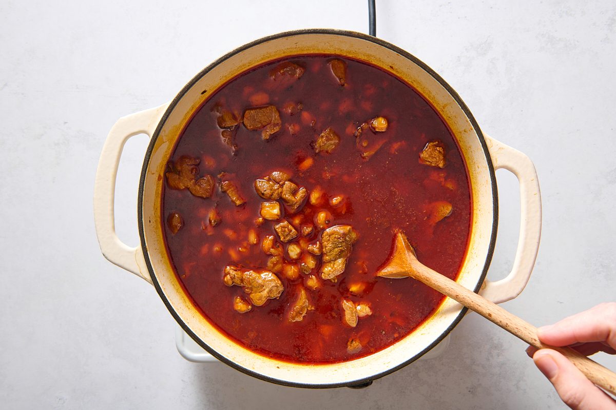 All of the soup ingredients combined with the meat in a dutch oven