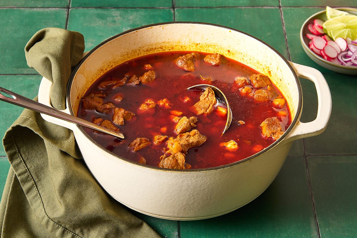 Pozole in a large pot with a ladle