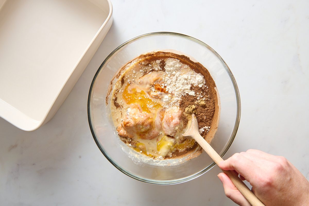 Combining pumpkin base ingredients in a bowl