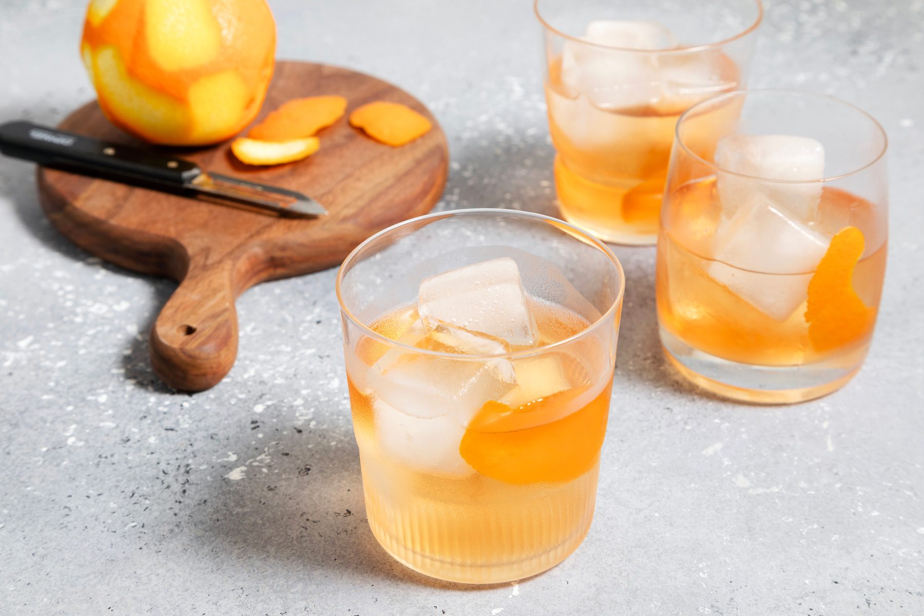 Rusty Nail glasses with oranges in the background