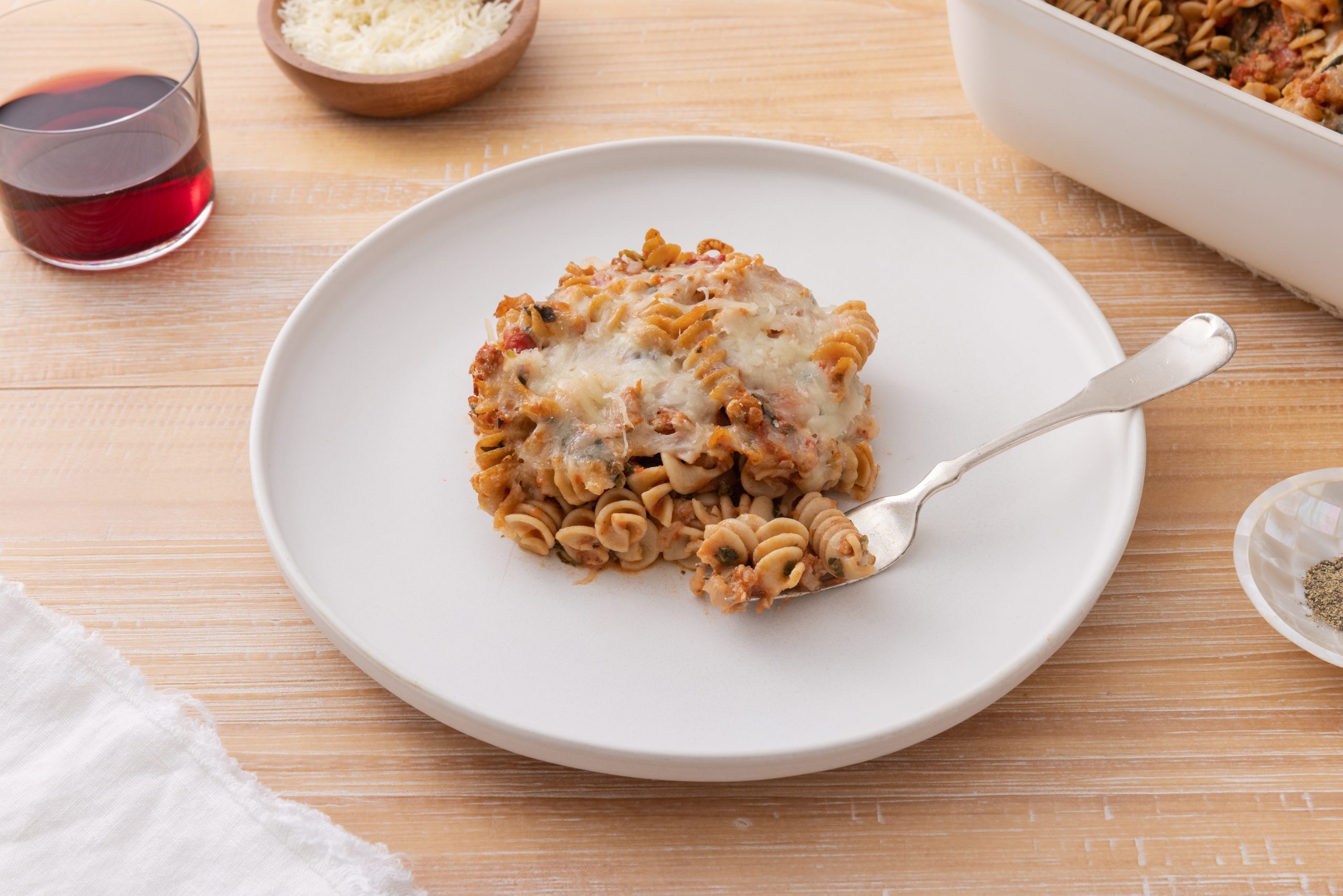 Pasta bake served on plate with fork.