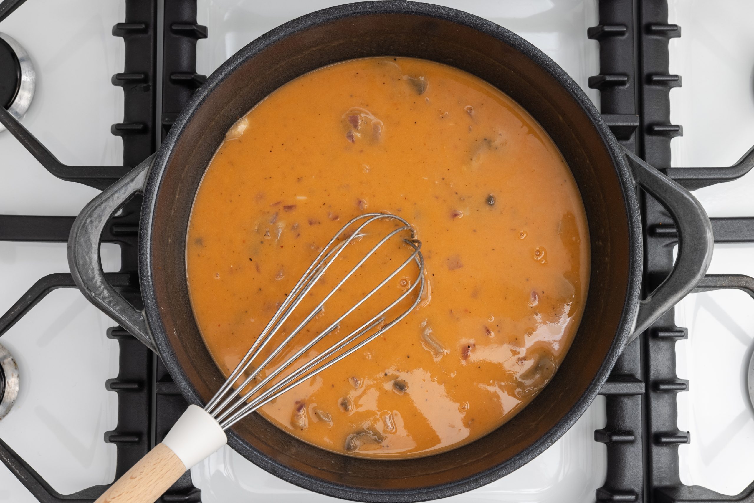 Dutch oven with melted butter, onions, mushrooms, tomato paste, salt, pepper and flour mixed in.