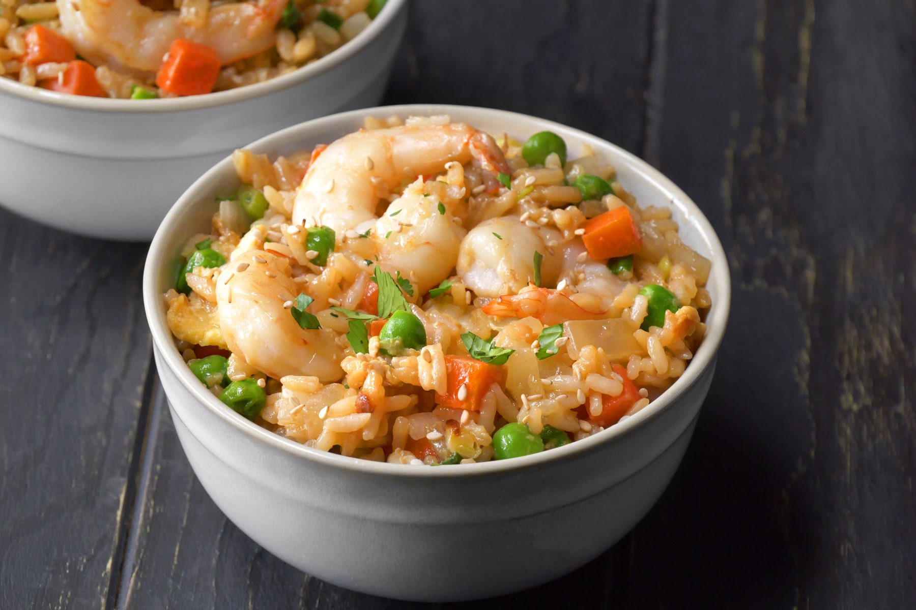 Shrimp Fried Rice garnished with cilantro and sesame seeds.