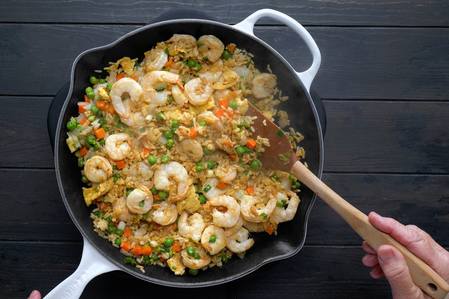 Stir in the rice, soy sauce, green onions, sesame oil and shrimp mixture.