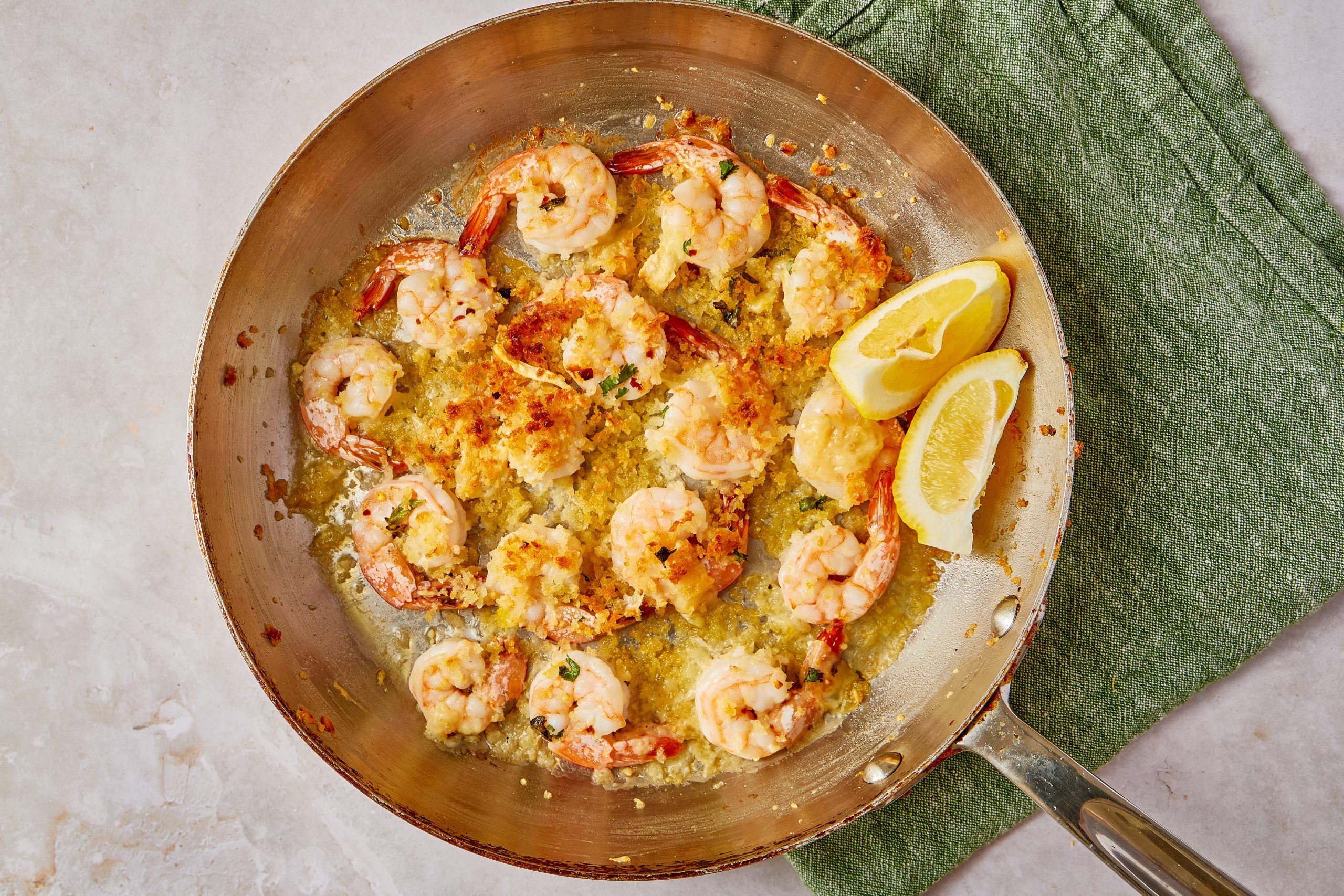 This Italian-style dish will give you that restaurant environment for those nights when you want something a little fancy. Shrimp is flavored with a light sauce made of garlic, lemon, oregano and white wine and then covered in a crust of panko bread crumbs mixed with Parmesan cheese.