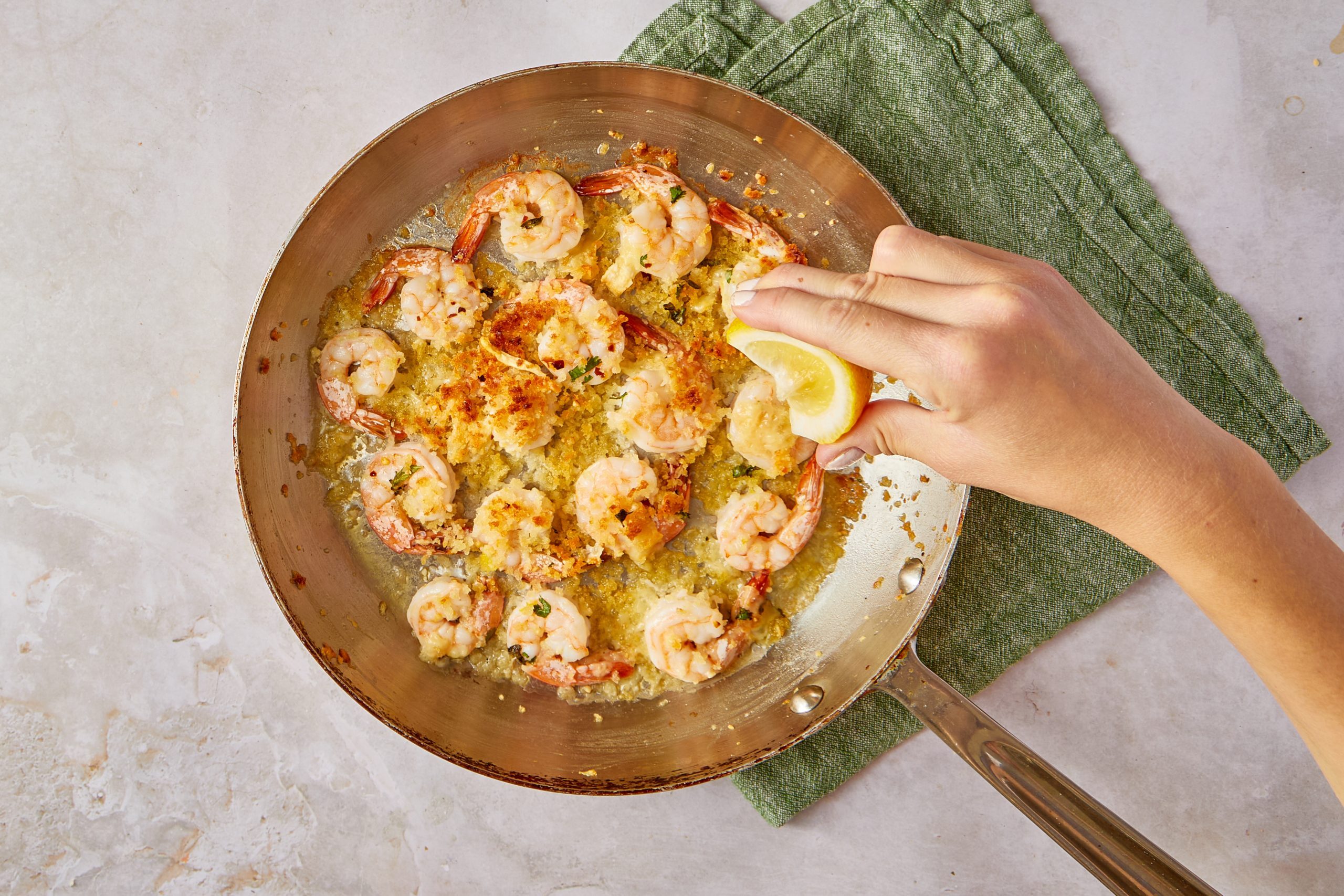 This Italian-style dish will give you that restaurant environment for those nights when you want something a little fancy. Shrimp is flavored with a light sauce made of garlic, lemon, oregano and white wine and then covered in a crust of panko bread crumbs mixed with Parmesan cheese.