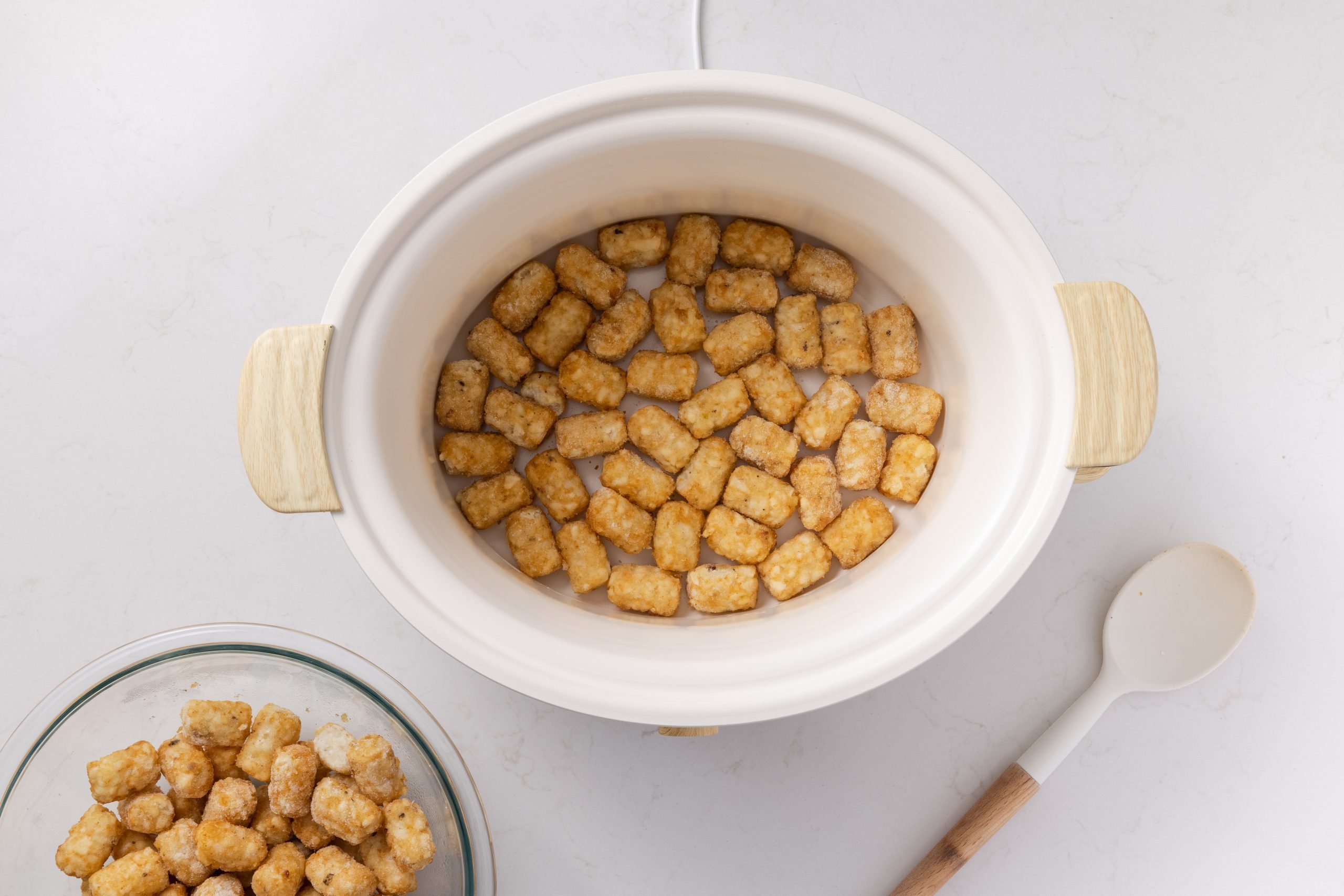 Tater Tots arranged on slow cooker