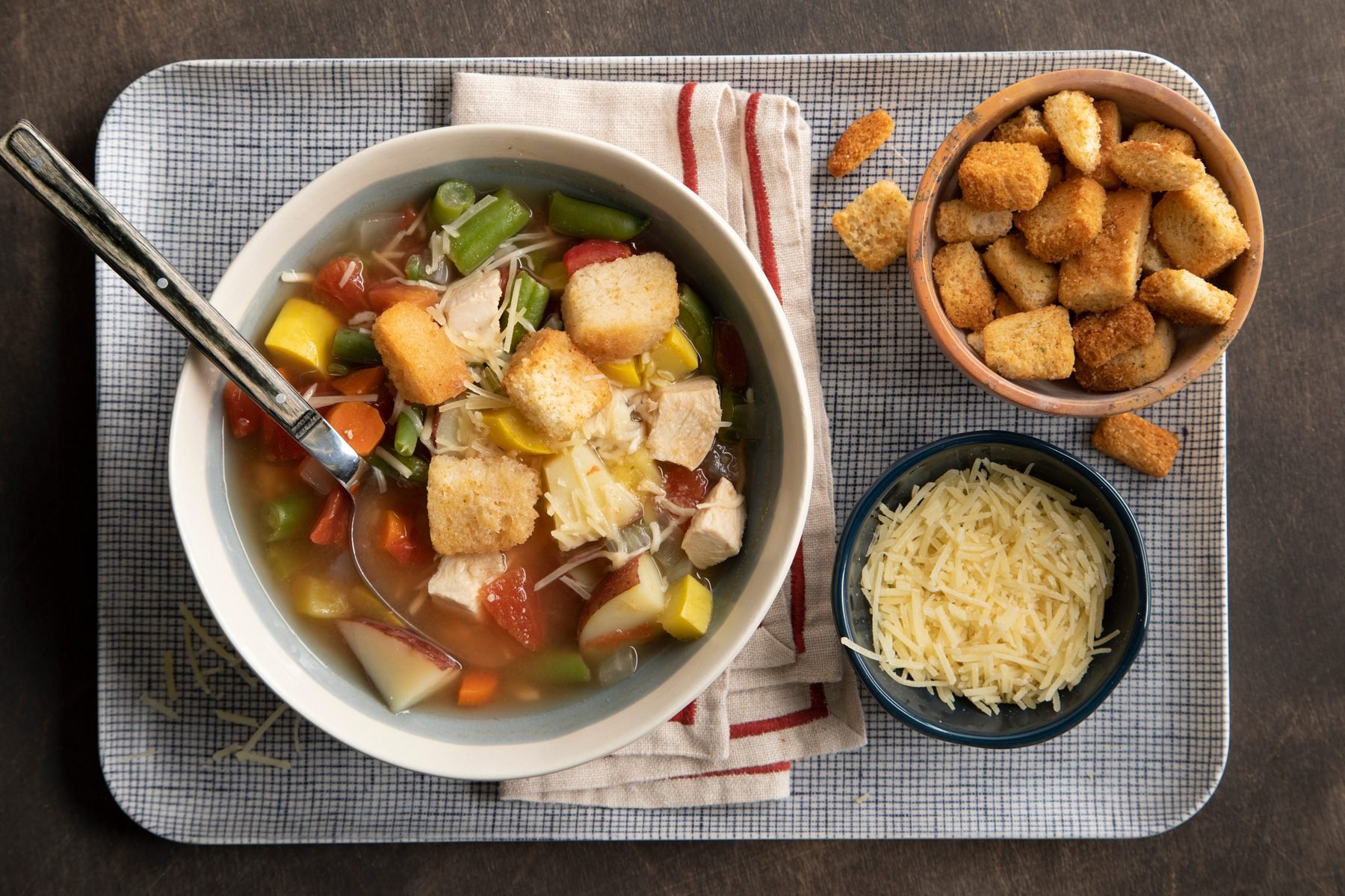 Two bowls of stone soup served on a tray.