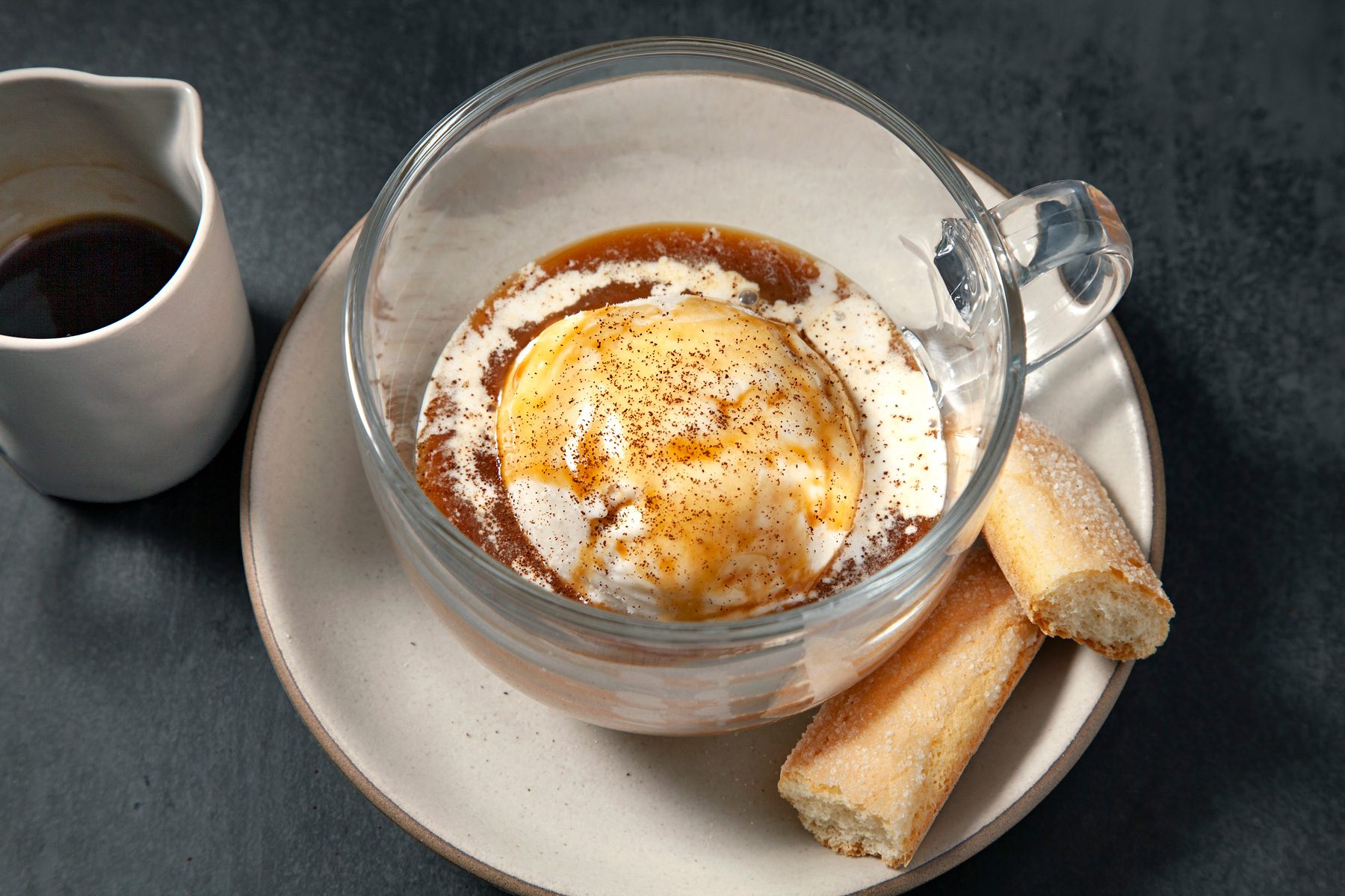 Top view shot of Affogato in a glass cup with expresso and bread sticks 