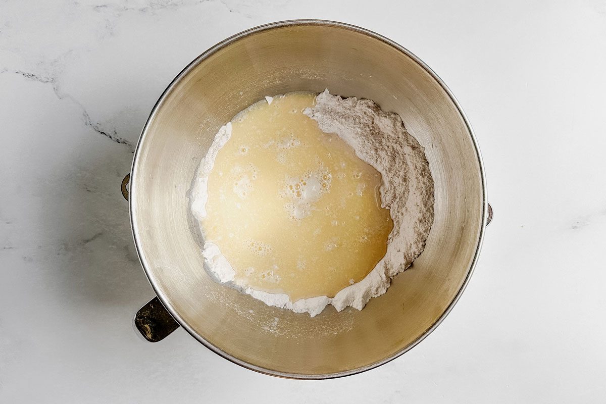 Unmixed dough in mixing bowl for Taste of Home apple cinnamon rolls.