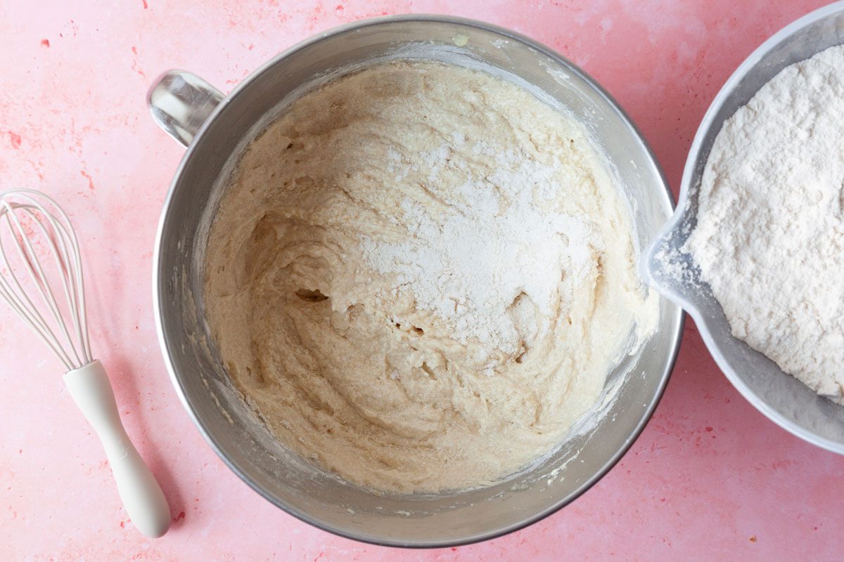 Step 1 of Taste of Home Applesauce Muffins is to cream the butter and sugar until light and fluffy, beat in the eggs and vanilla. Stir in the applesauce. In a separate bowl, combine the flour, baking soda and spices, then stir that dry mixture into the creamed mixture. Fold in the walnuts, if you're using them.