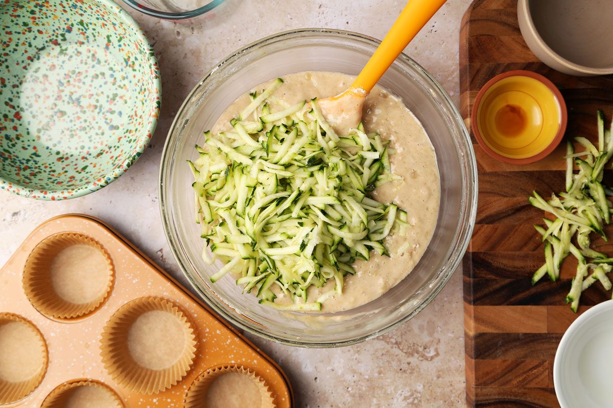 Process shot of Taste of Home's Banana Zucchini Muffins. Making the batter in a bowl.