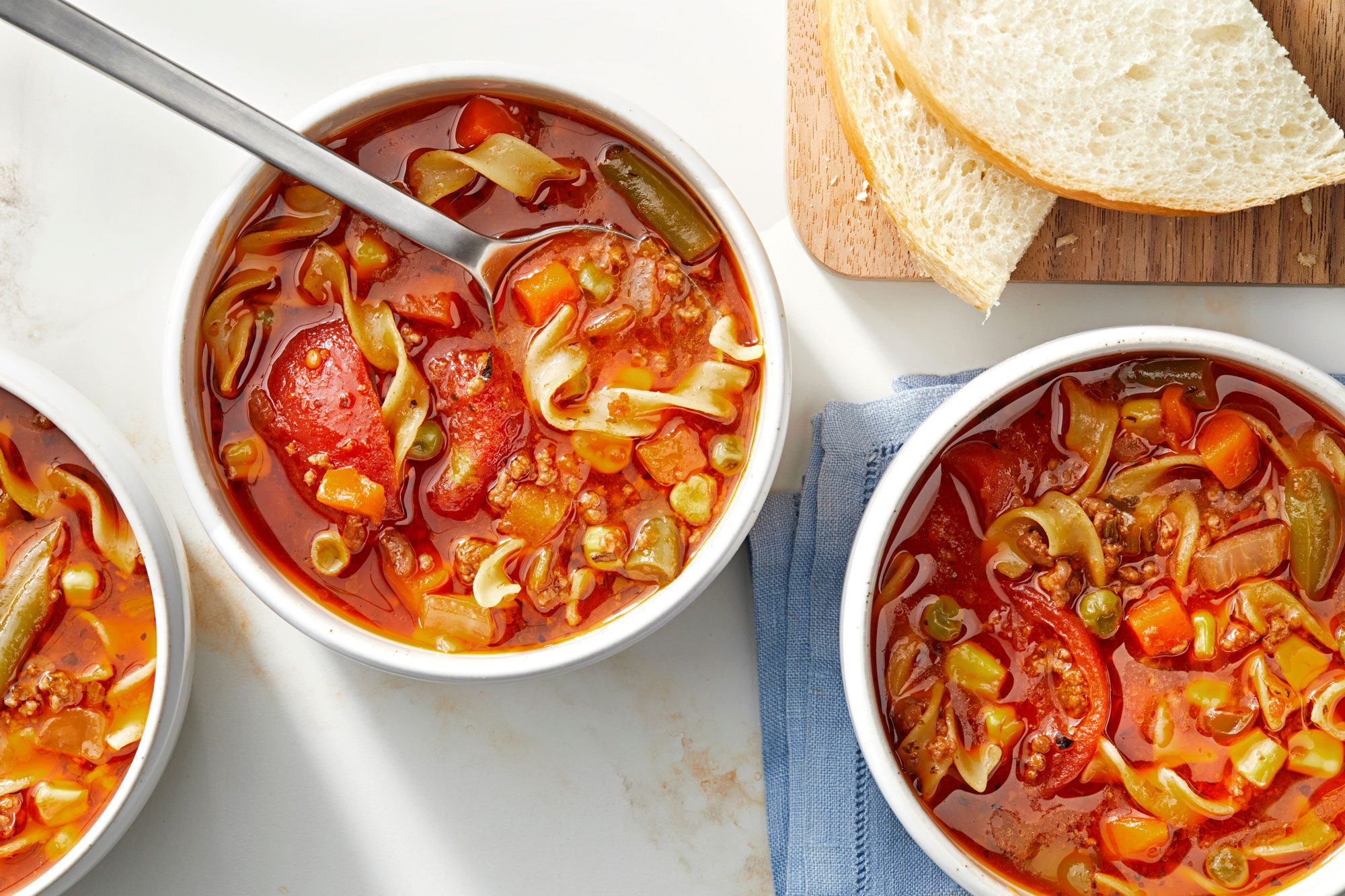 Beef Noodle Soup served in bowls with slices of bread