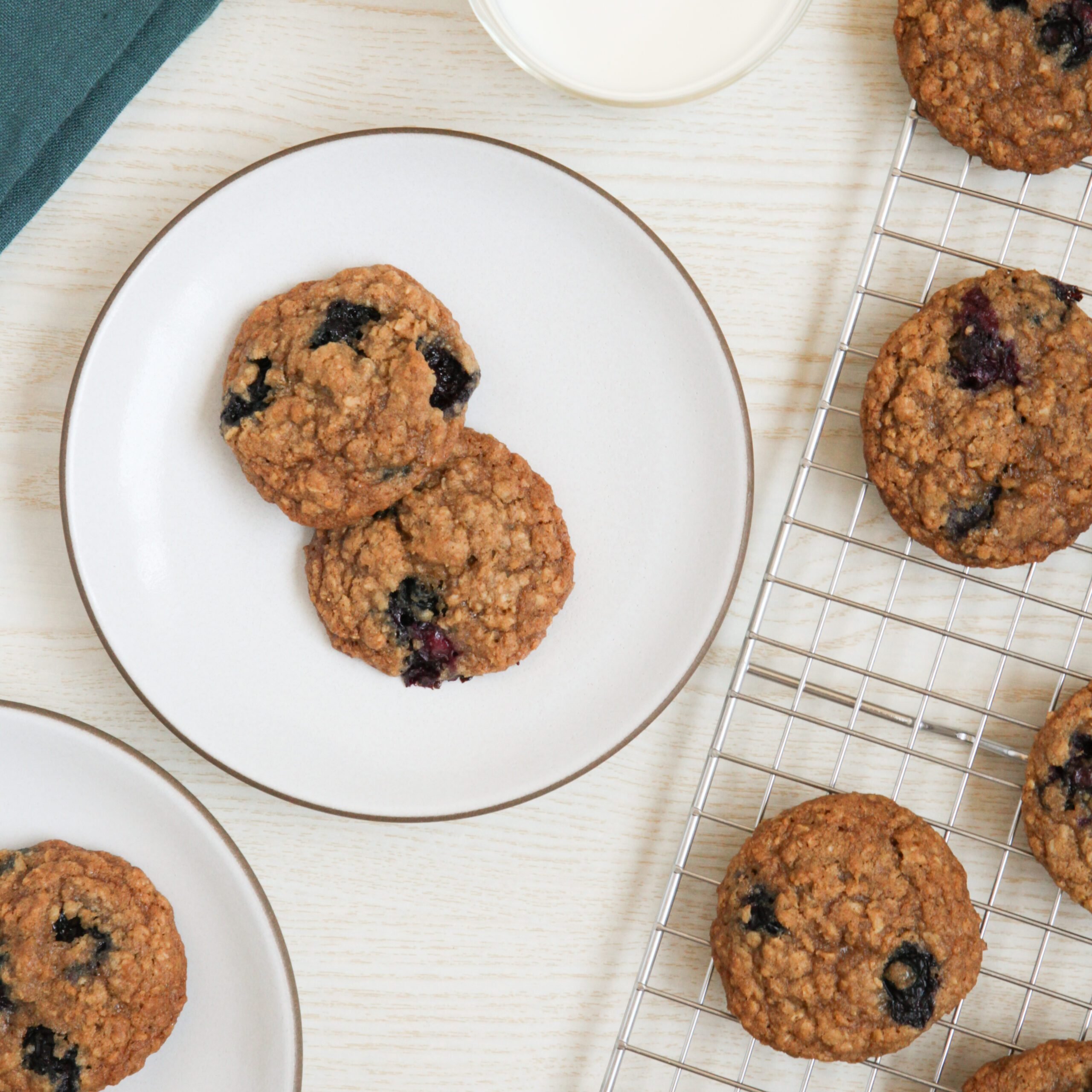 Blueberry Oatmeal Cookies on a plate with a glass of milk