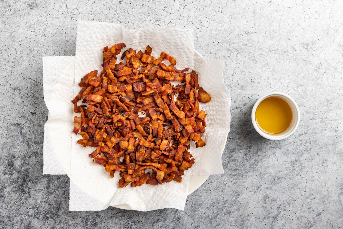 Taste of Home Bourbon Bacon Jam recipe photo of the cooked bacon and reserved drippings.