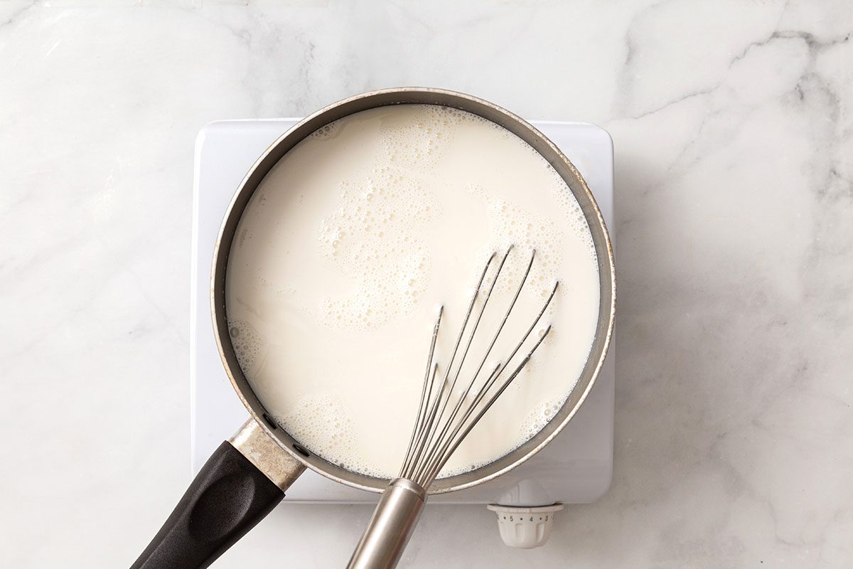 Cream, milk, vanilla extract, sugar and salt mix in heavy saucepan for step 2 for Butter Brickle Ice Cream for Taste of Home