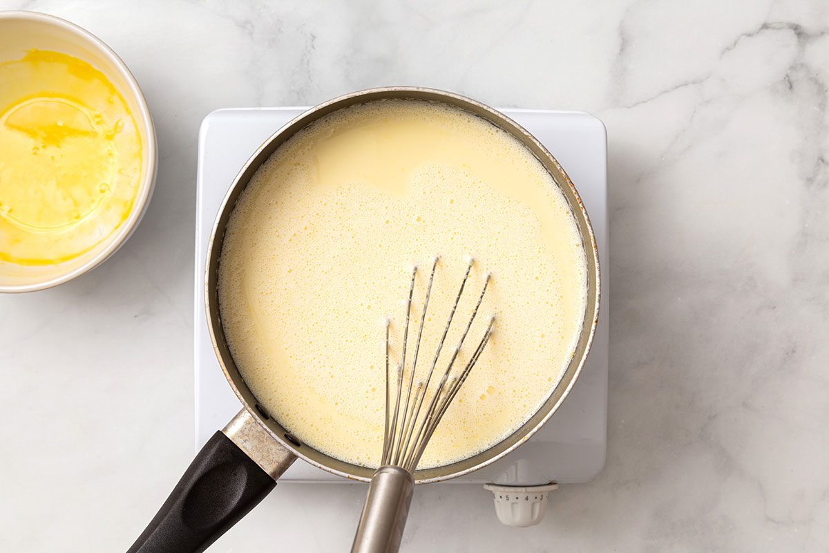 Milk and egg mixture cooking in sauce pan for step 3 for Butter Brickle Ice Cream recipe for Taste of Home