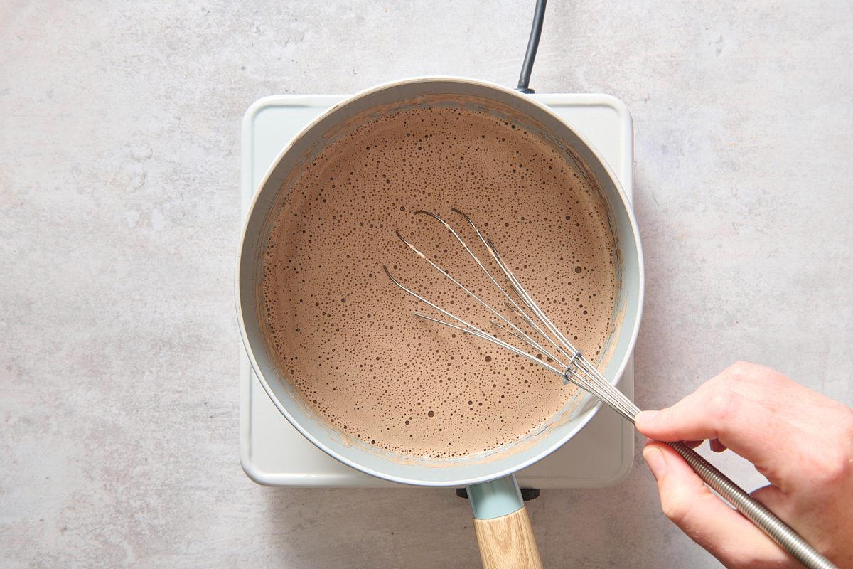 Whisking the mocha mixture in a saucepan