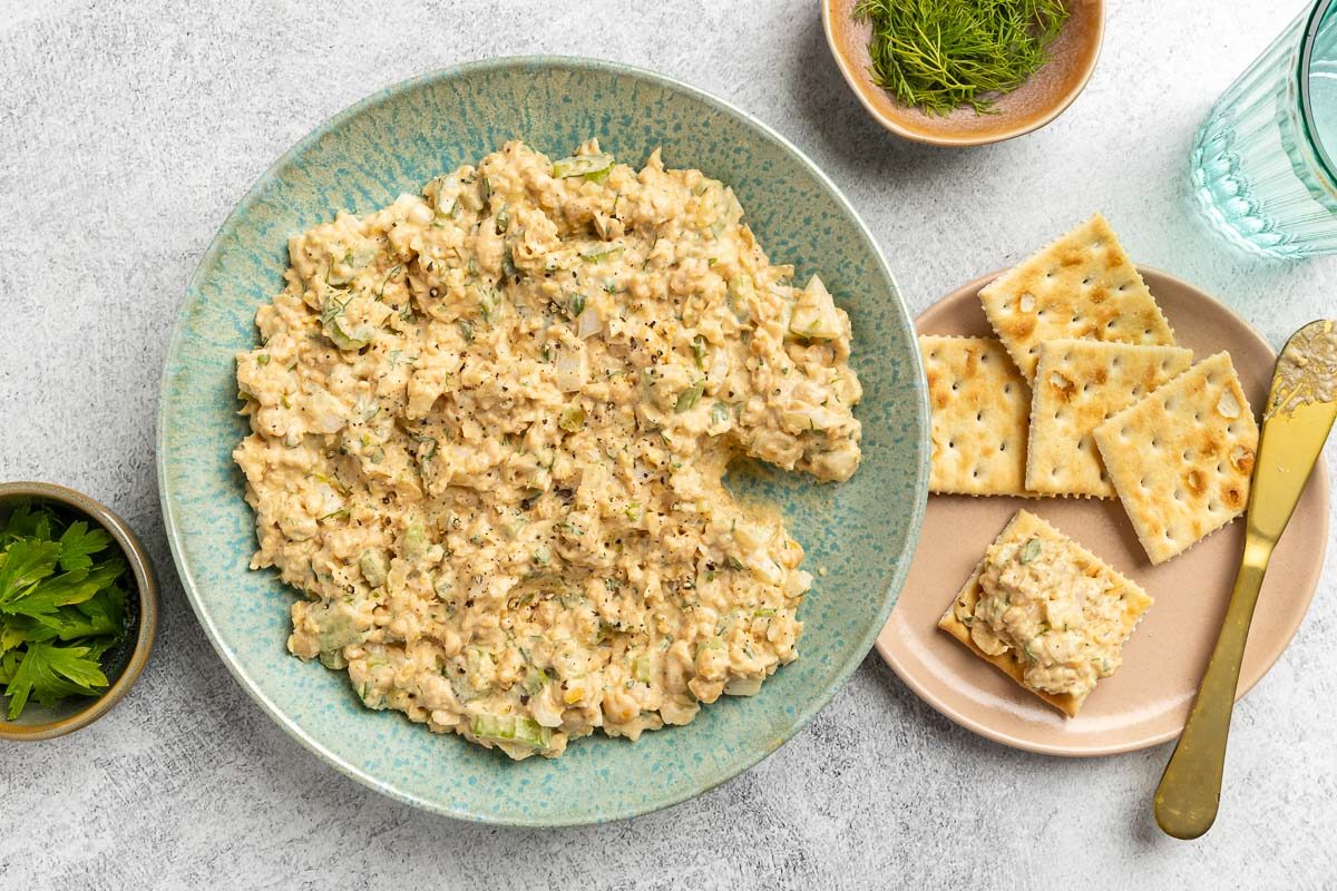 Taste of Home Chickpea Tuna Salad recipe photo of the finished recipe in a bowl with a side of saltine crackers.