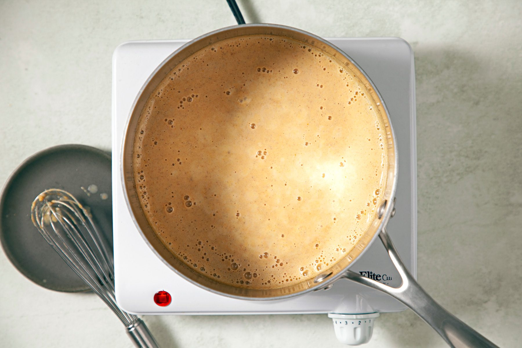 Top view shot of ingredients in sauce pan