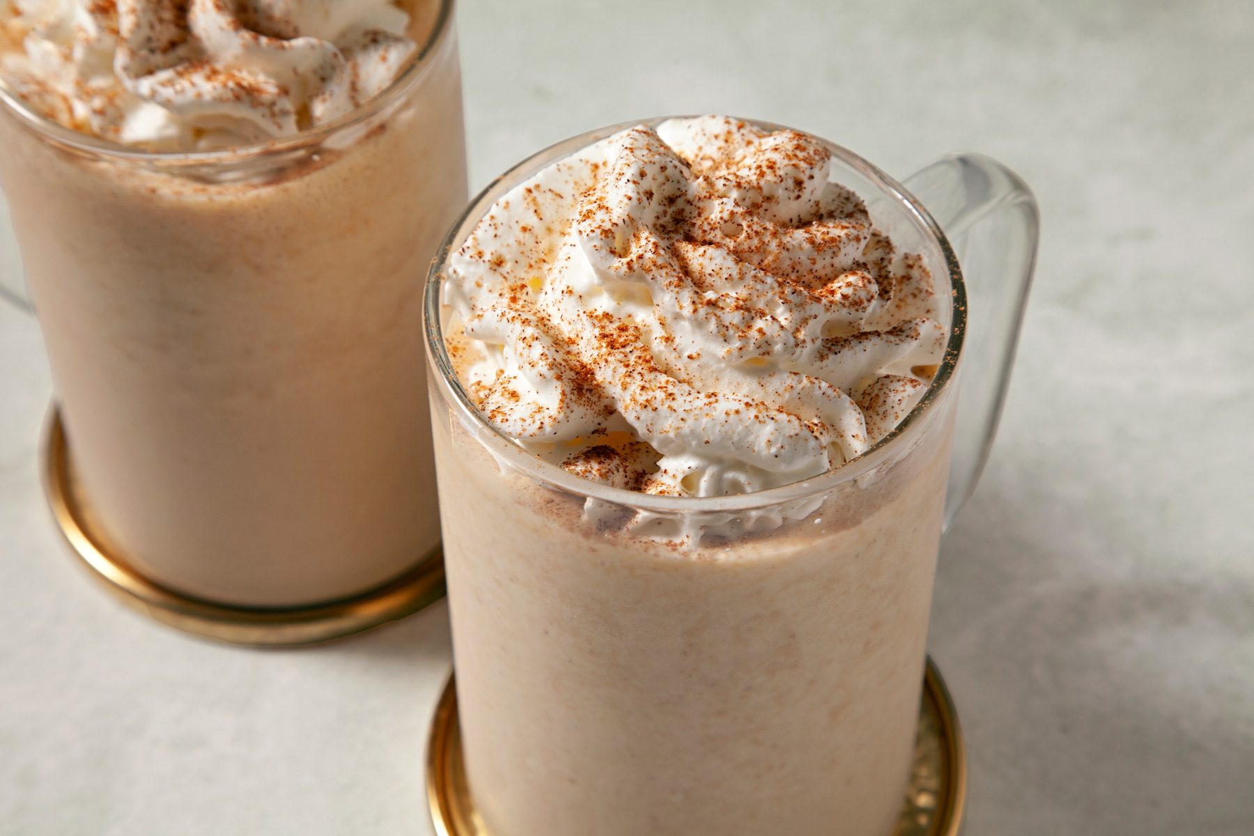 Close up shot of Copycat Starbucks Pumpkin Spice Frappuccino in two mugs