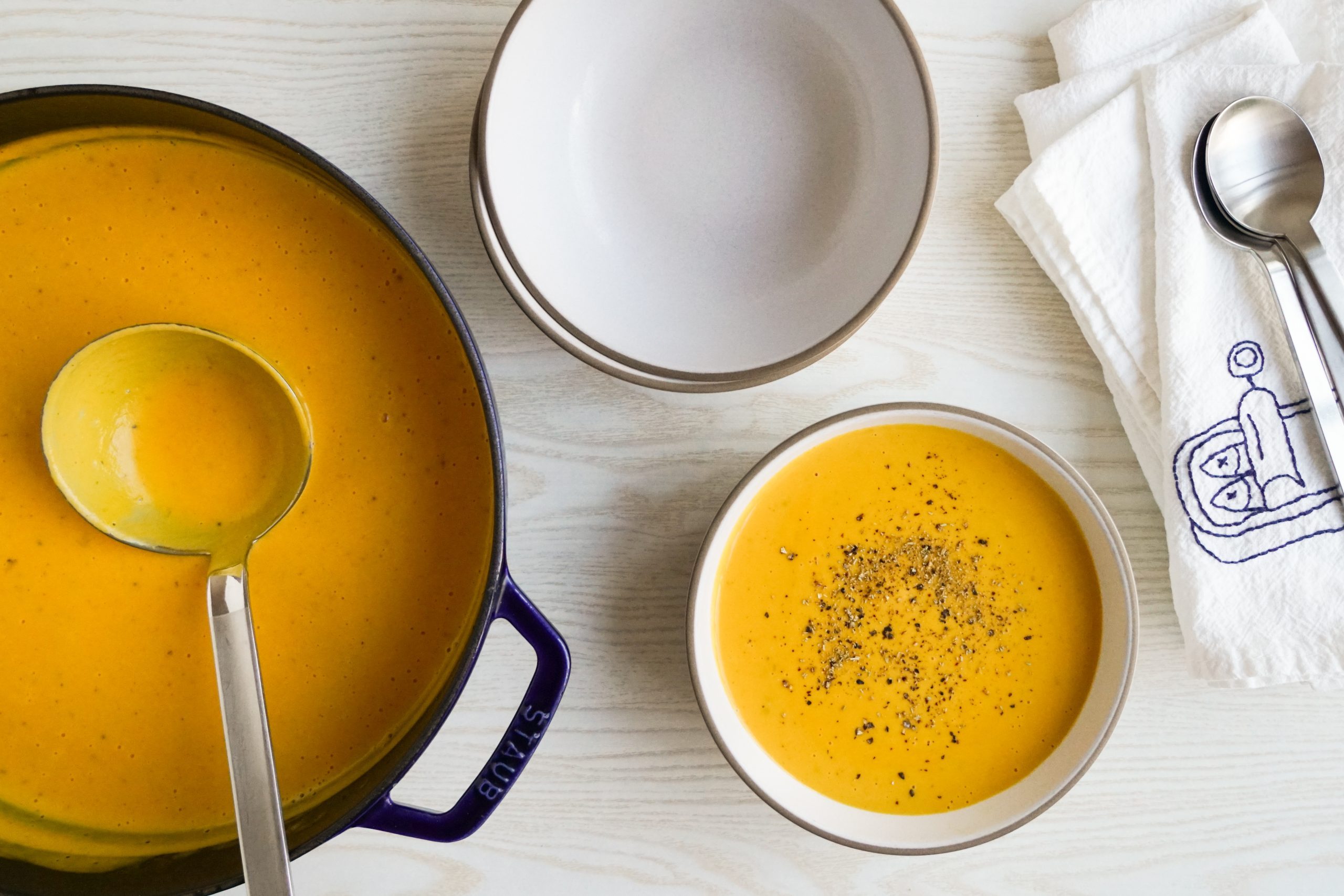 Serving creamy carrot soup