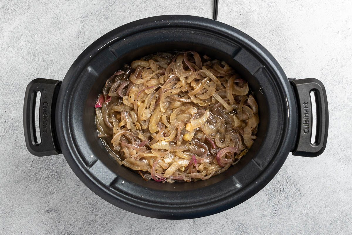 Taste of Home Crock Pot French Onion Soup recipe photo of the carmelized onions in a slow cooker.