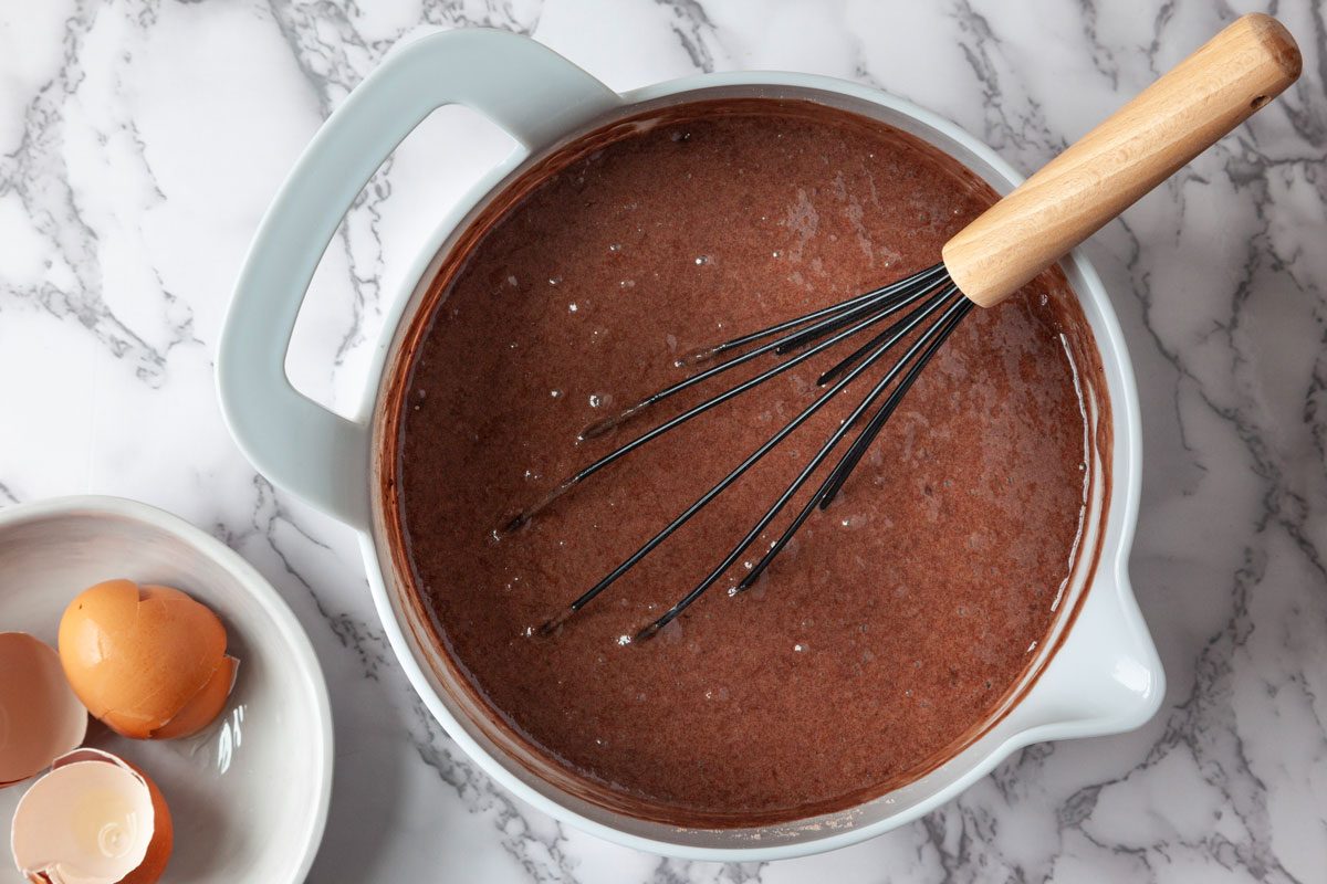 Step 1 of Taste of Home Crock-Pot Lava Cake is to combine the cake mix, water, eggs and oil. Beat these together on low speed for 30 seconds, then on medium speed for two minutes. Transfer the batter to a greased 4-quart slow cooker.