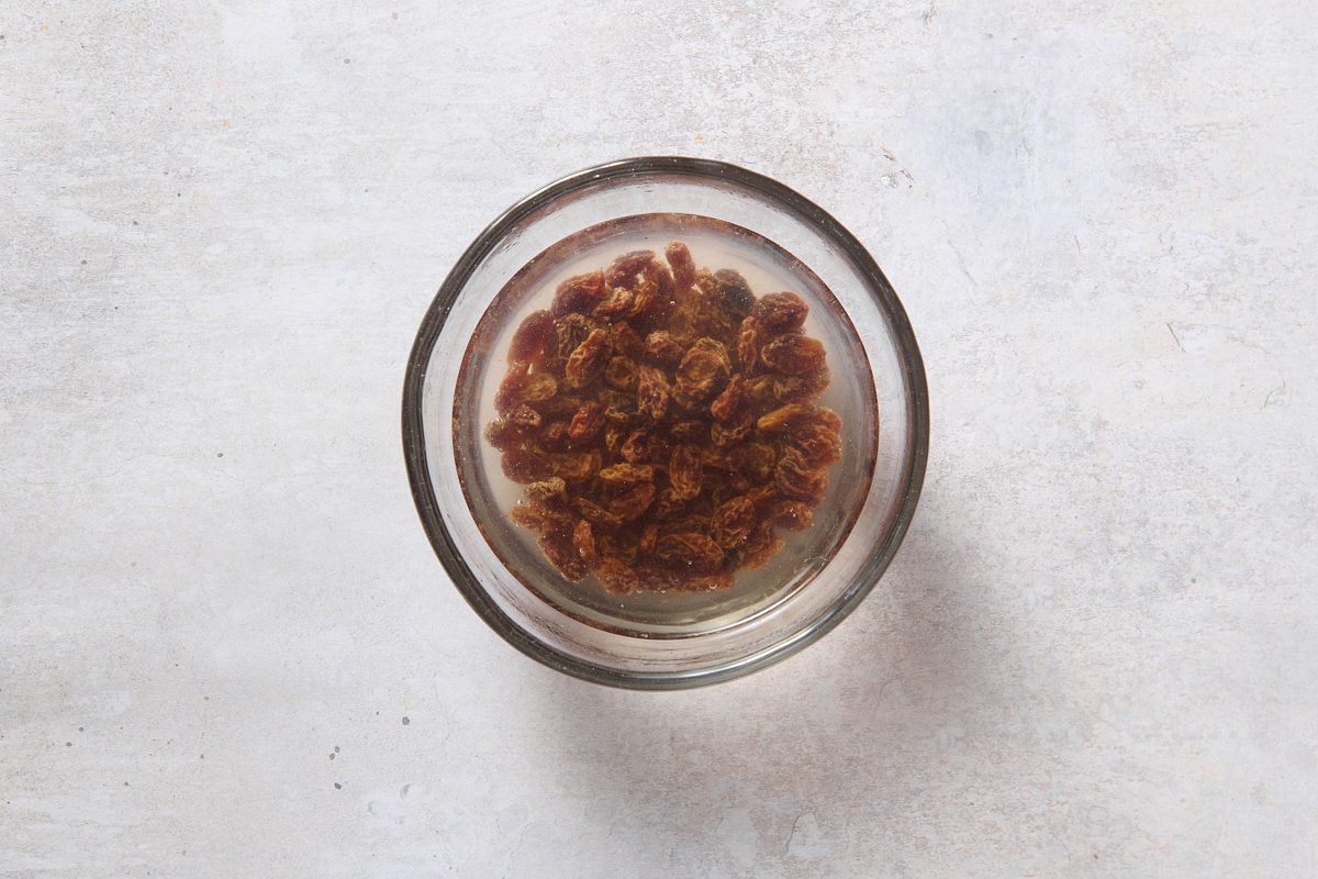 Plumping the raisins in boiling water