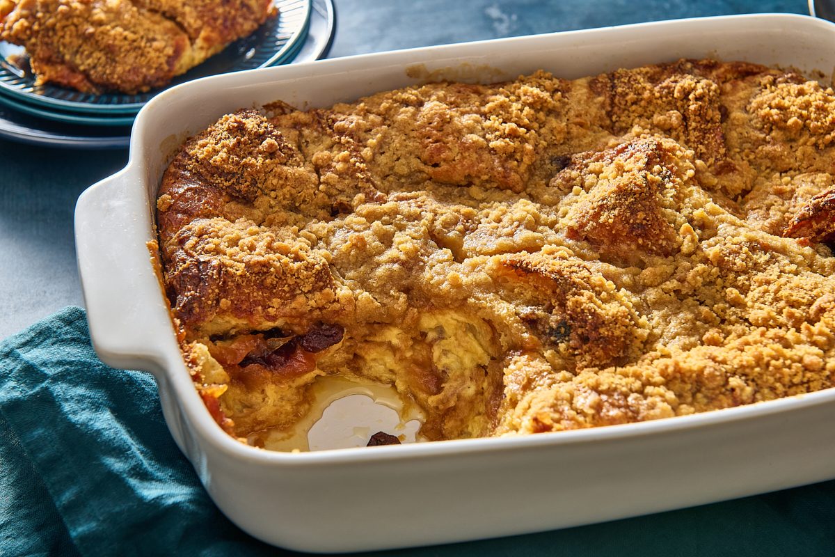 Closeup of croissant bread pudding after a portion has been scooped out