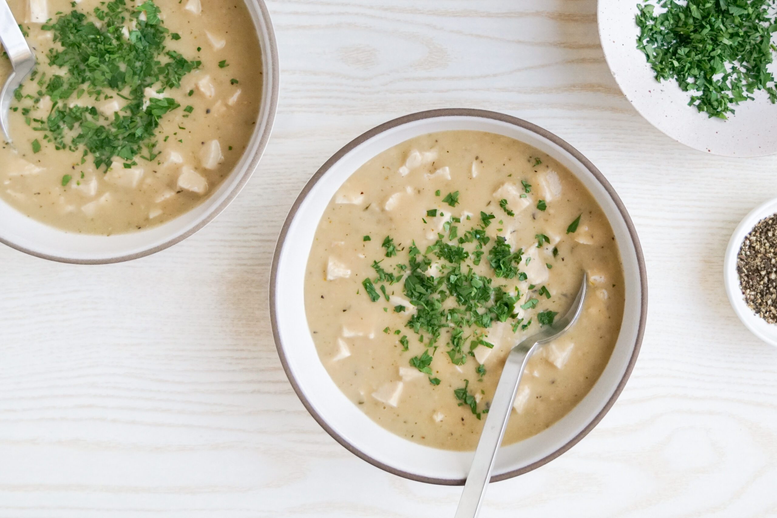 Dairy Free Cream Of Chicken Soup garnished with parsley and pepper