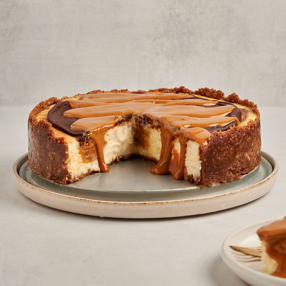 This decadent dulce de leche cheesecake by Taste of Home features rich cream cheese filling with swirls of dulce de leche.