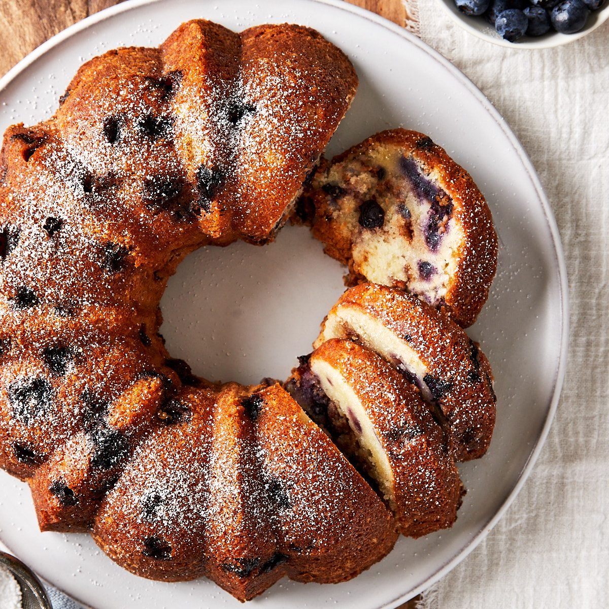 Close up of partially sliced Blueberry Coffee Cake