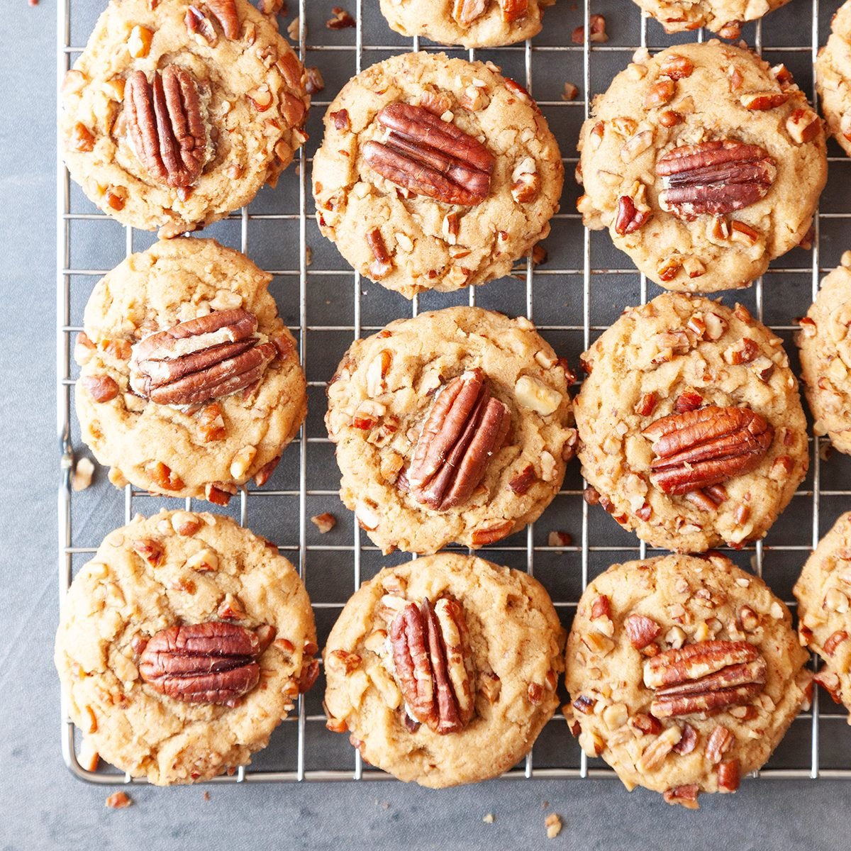 Full Yield Of Taste Of Home Butter Pecan Cookies On A Cooling Rack