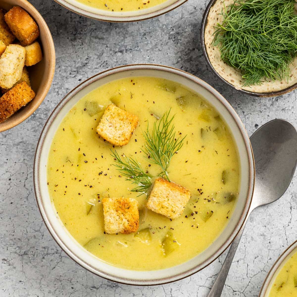 Taste of Home Dill Pickle Soup recipe photo of the finished recipe served into bowls.